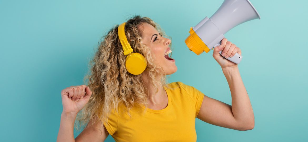 woman-sings-with-loudspeaker-listen-music-with-headset-joyful-expression